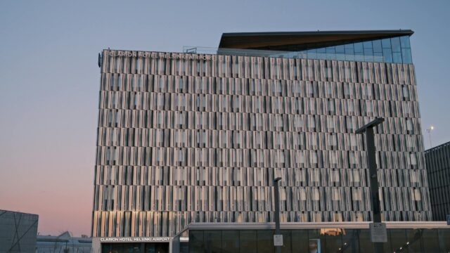 Stunning view of Clarion Hotel Helsinki Airport with evening sky colors.